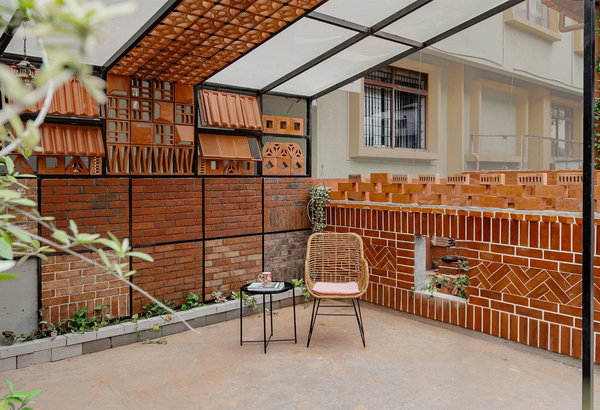 Modern indoor space with brick walls, a chair, and decorative elements.
